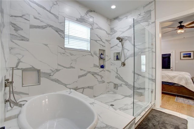 bathroom featuring ceiling fan, hardwood / wood-style floors, and independent shower and bath