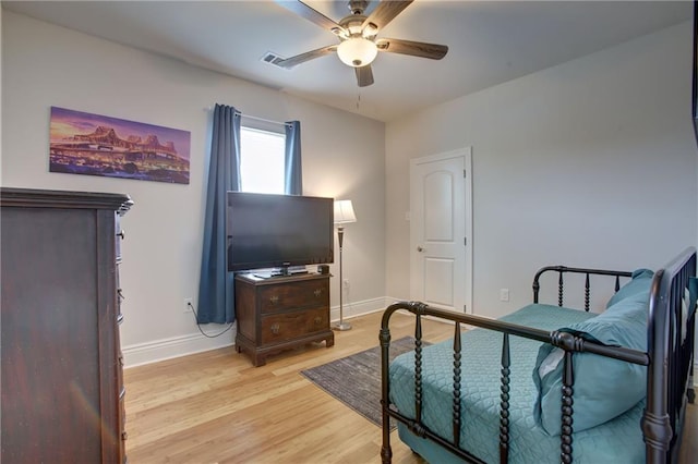 sitting room with ceiling fan and light wood-type flooring