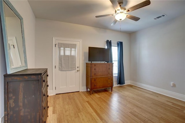 entryway with ceiling fan and light hardwood / wood-style flooring