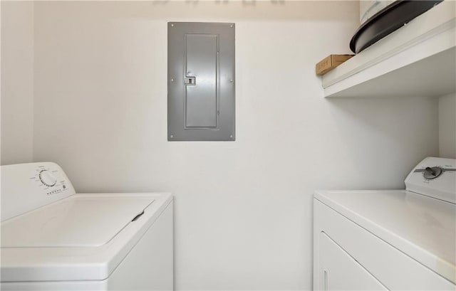 laundry area with washer and dryer and electric panel