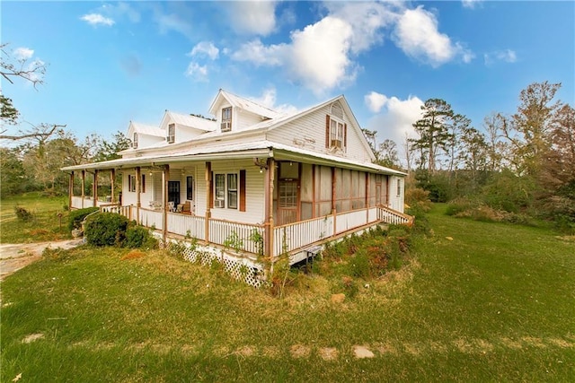 view of property exterior featuring a yard and a porch