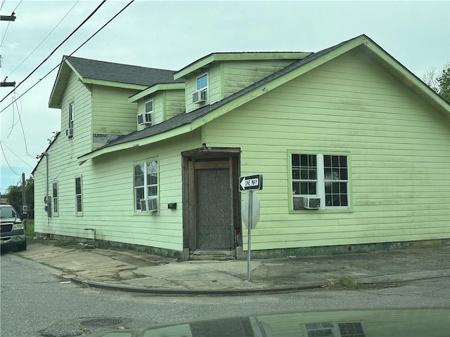 view of front of house featuring cooling unit