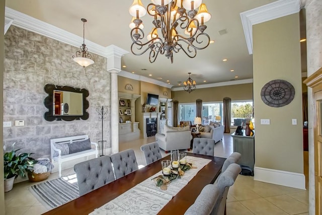 dining area featuring a chandelier, light tile patterned floors, decorative columns, and crown molding