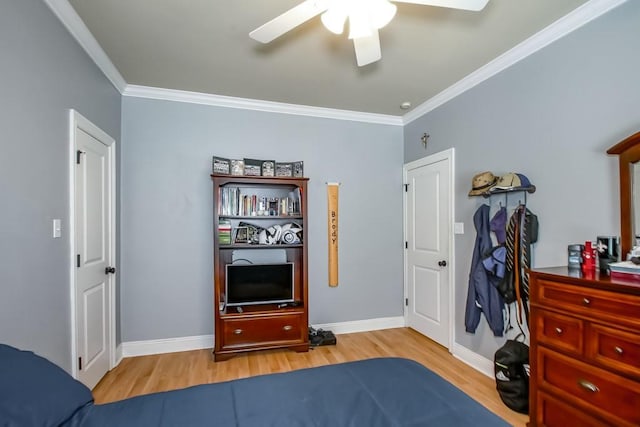 bedroom with light hardwood / wood-style floors, ceiling fan, and ornamental molding