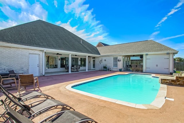 view of pool featuring ceiling fan and a patio