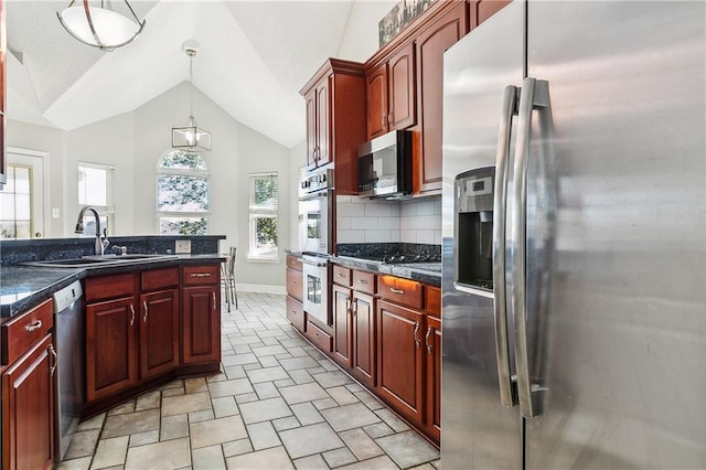 kitchen with tasteful backsplash, stainless steel appliances, sink, high vaulted ceiling, and hanging light fixtures