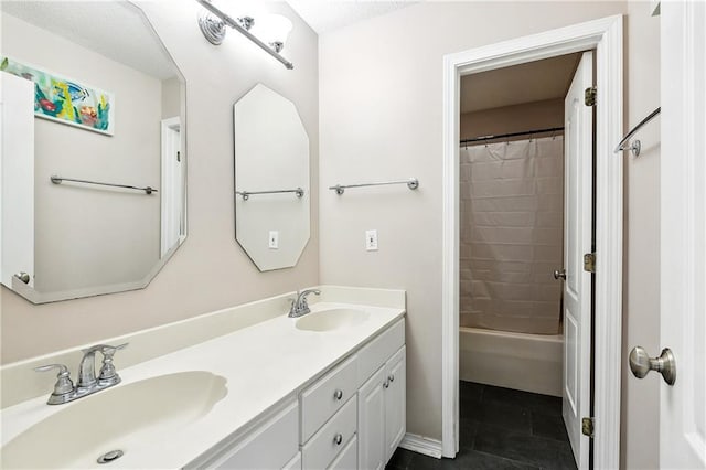 bathroom featuring tile patterned flooring, vanity, and shower / tub combo with curtain