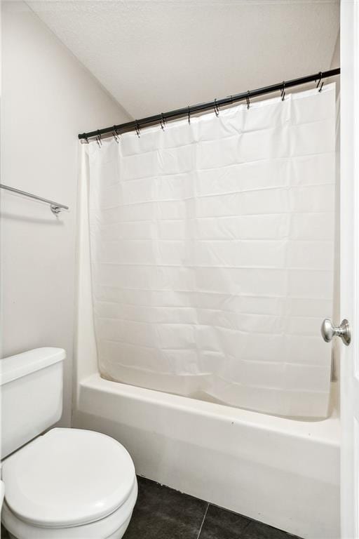 bathroom with tile patterned flooring and toilet