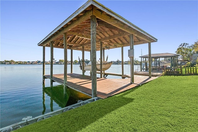 view of dock featuring a yard and a water view