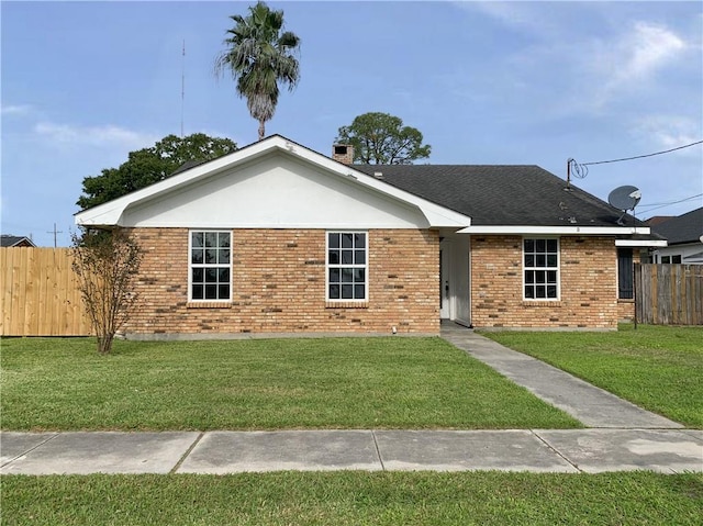 ranch-style house with a front lawn