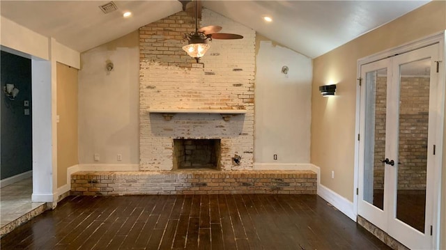 unfurnished living room with ceiling fan, french doors, dark wood-type flooring, and vaulted ceiling