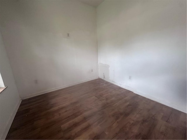 empty room featuring dark hardwood / wood-style floors