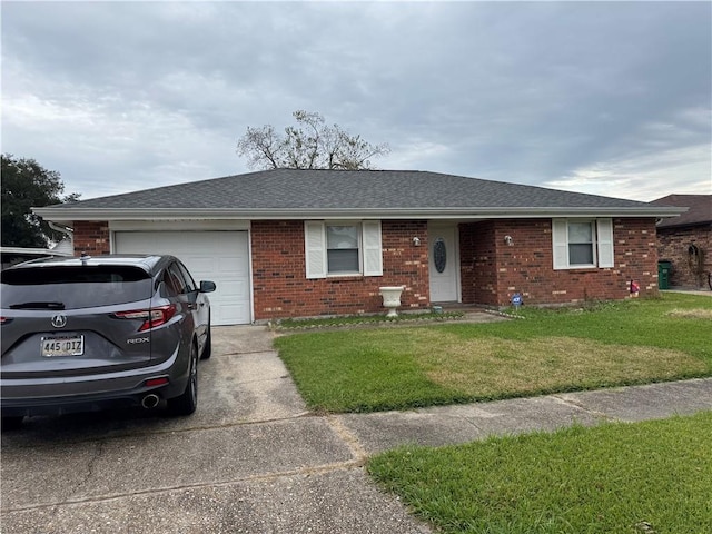 ranch-style home featuring a front lawn and a garage