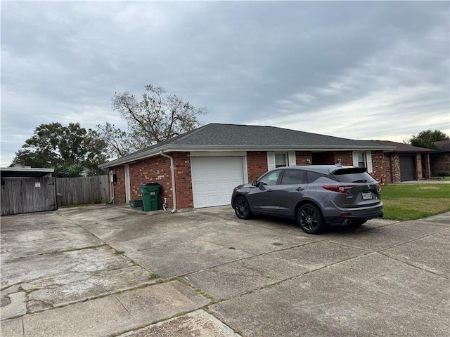 view of side of home with a garage