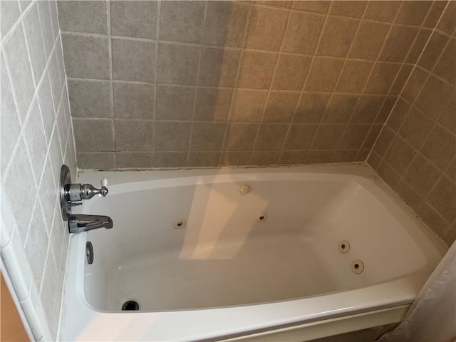 bathroom with a tub to relax in