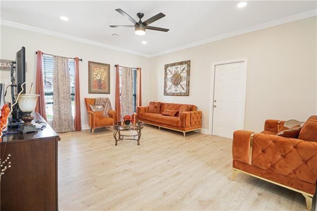 living room with ceiling fan, light hardwood / wood-style flooring, and ornamental molding