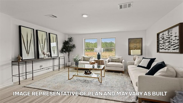 living room with light hardwood / wood-style flooring