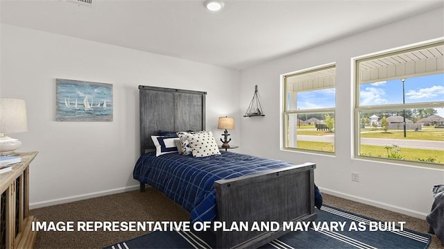 bedroom featuring dark colored carpet