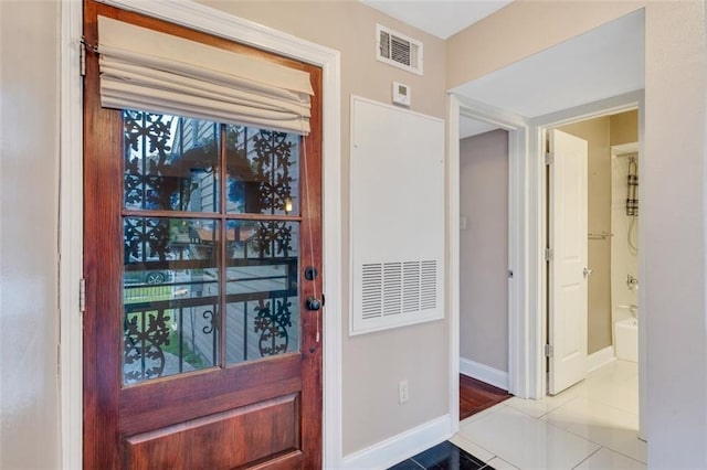 entryway featuring light tile patterned flooring