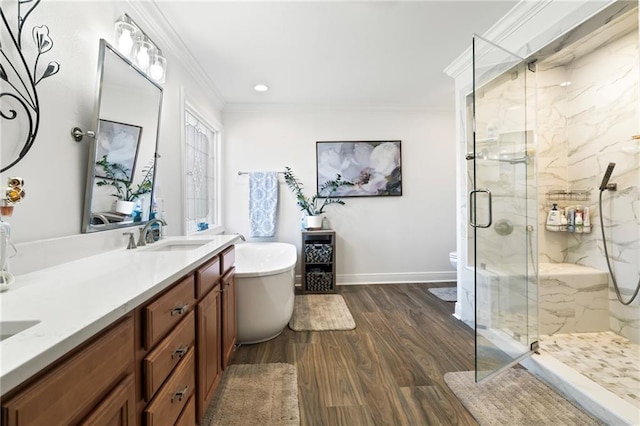 full bathroom with vanity, crown molding, hardwood / wood-style floors, and plus walk in shower