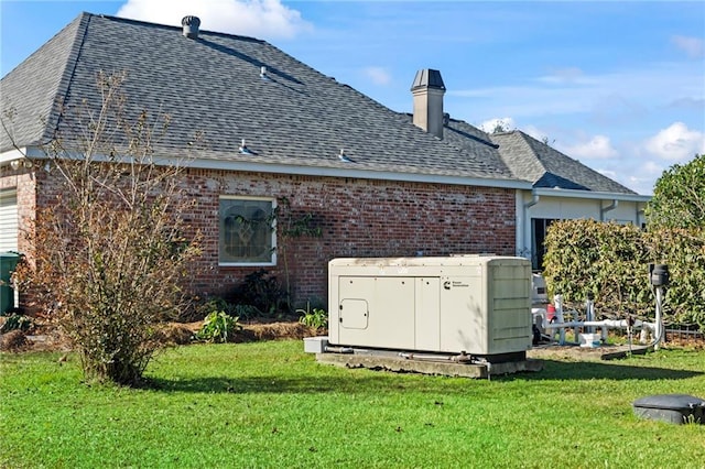 rear view of property with a yard