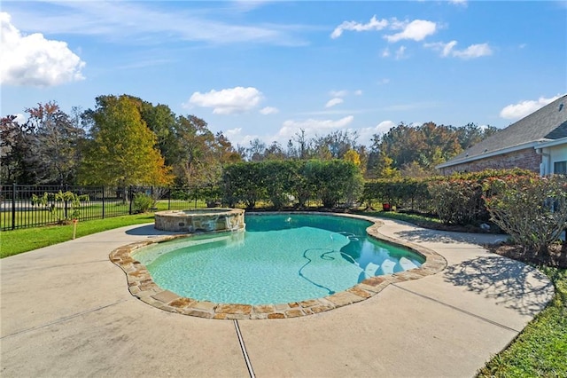 view of swimming pool with an in ground hot tub and a patio