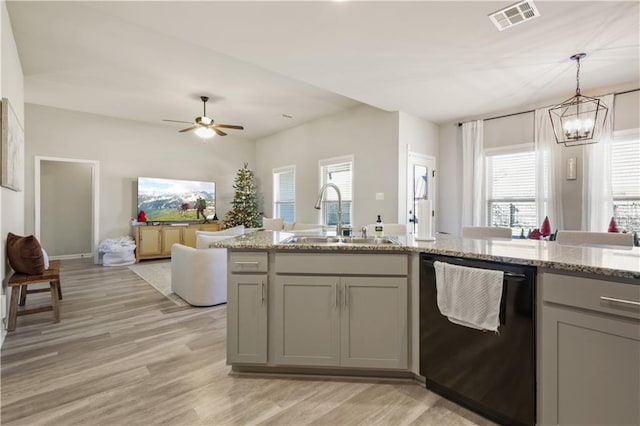 kitchen with gray cabinetry, dishwasher, plenty of natural light, and sink