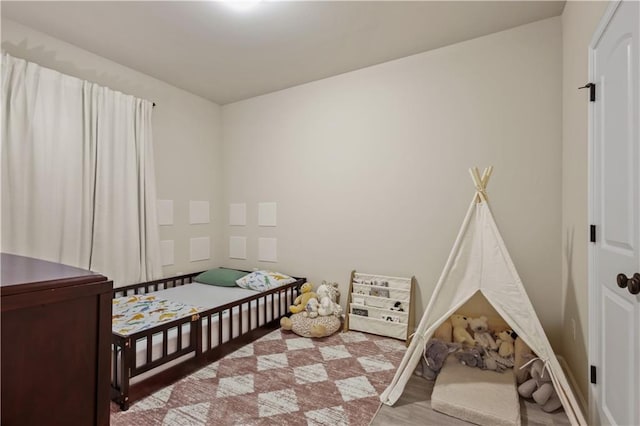 bedroom with light hardwood / wood-style floors