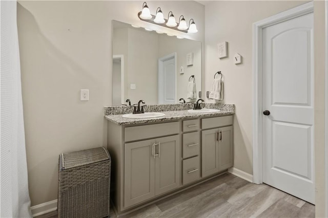 bathroom featuring vanity and hardwood / wood-style flooring