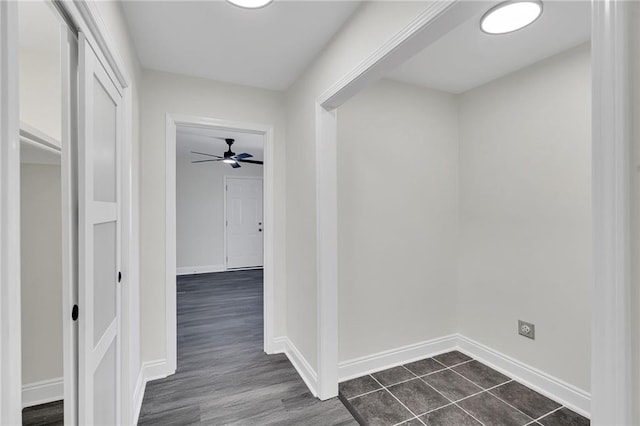 hallway featuring dark wood-type flooring