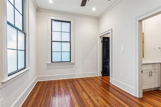 unfurnished bedroom featuring ornamental molding, dark wood-type flooring, connected bathroom, and ceiling fan