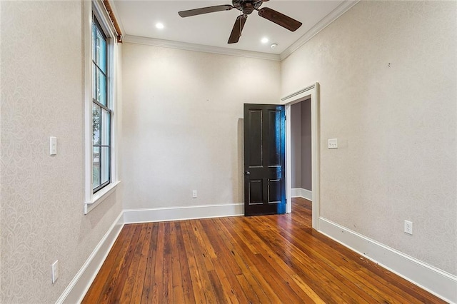 spare room featuring hardwood / wood-style flooring, ornamental molding, and plenty of natural light