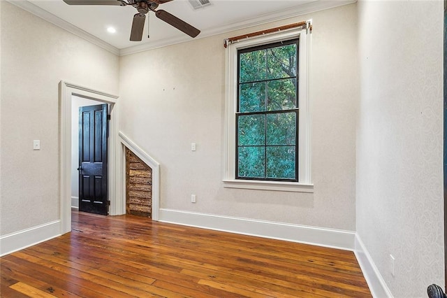 unfurnished living room with crown molding, ceiling fan, and wood-type flooring