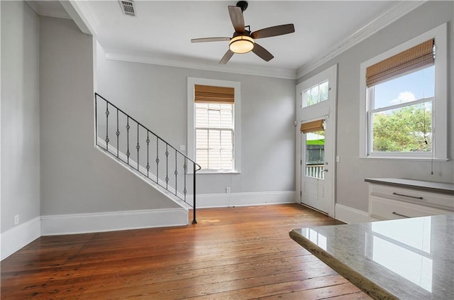 entrance foyer with ceiling fan, light hardwood / wood-style floors, and ornamental molding