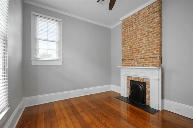 unfurnished living room featuring ceiling fan, ornamental molding, and hardwood / wood-style flooring