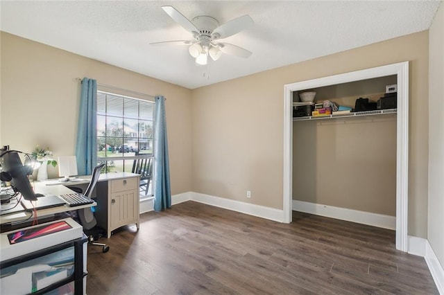 office space with ceiling fan and dark hardwood / wood-style floors