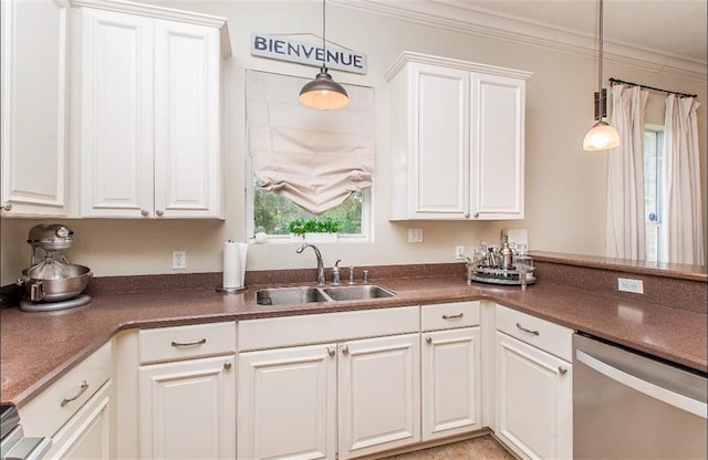 kitchen featuring stainless steel dishwasher, crown molding, sink, pendant lighting, and white cabinetry