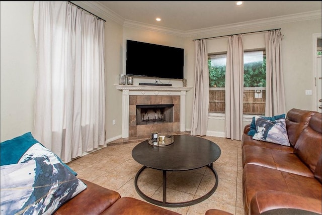 tiled living room featuring a tiled fireplace and crown molding