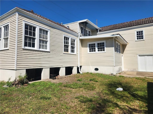 view of home's exterior with a yard