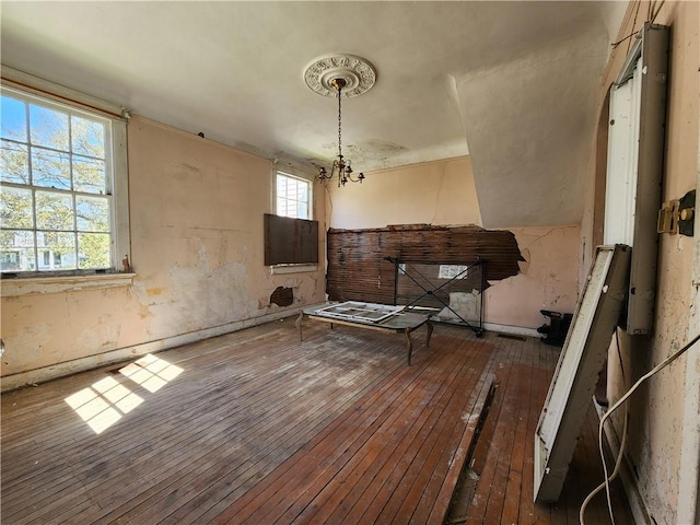 interior space featuring a chandelier and hardwood / wood-style floors