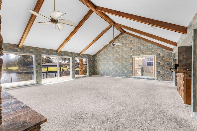 229 Constellation Dr, Slidell, LA 70458 - unfurnished living room featuring carpet, a water view, high vaulted ceiling, beamed ceiling, and ceiling fan