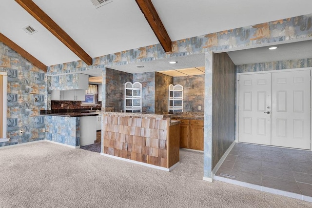 229 Constellation Dr, Slidell, LA 70458 - kitchen featuring carpet flooring, open floor plan, visible vents, and vaulted ceiling with beams