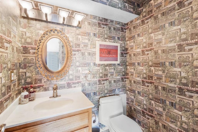 229 Constellation Dr, Slidell, LA 70458 - bathroom with vanity, toilet, and wallpapered walls