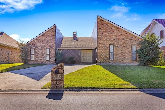 229 Constellation Dr, Slidell, LA 70458 - view of front of property with concrete driveway, a front lawn, a chimney, and brick siding