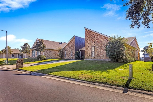 229 Constellation Dr, Slidell, LA 70458 - view of front of home featuring a front lawn, brick siding, and driveway