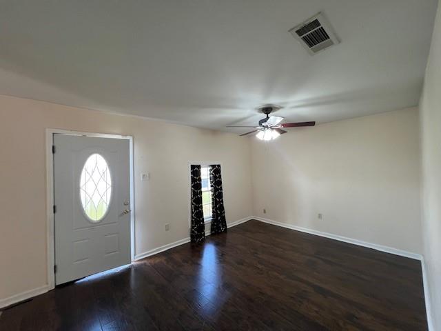 entryway with dark hardwood / wood-style floors and ceiling fan