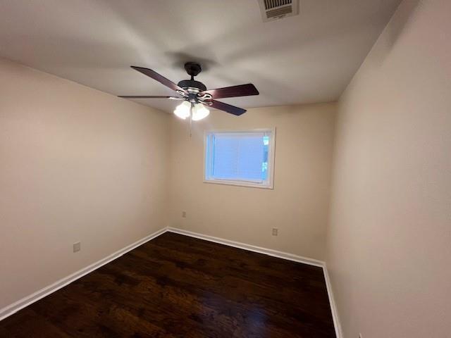 spare room featuring ceiling fan and hardwood / wood-style floors