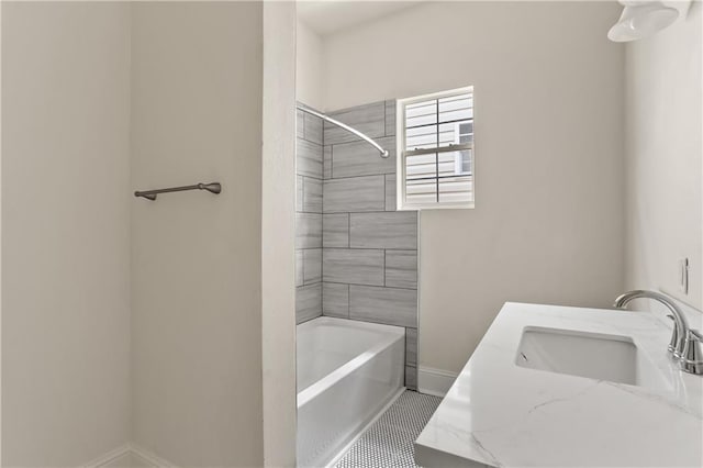 bathroom with vanity, tiled shower / bath combo, and tile patterned floors