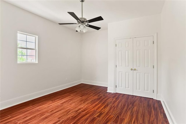 empty room with ceiling fan and hardwood / wood-style flooring