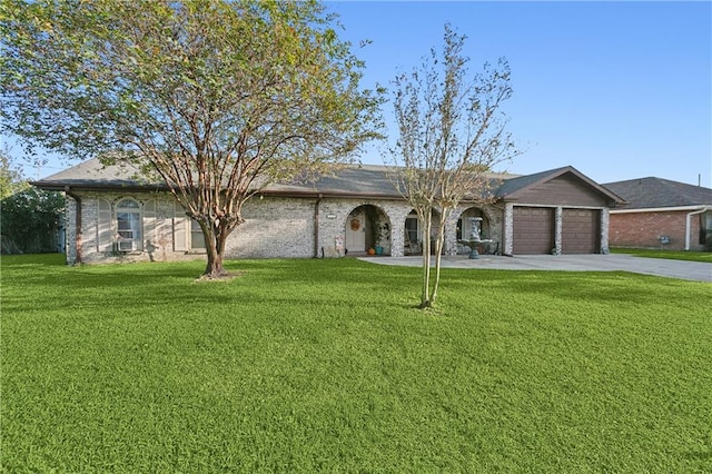 single story home with a front yard and a garage